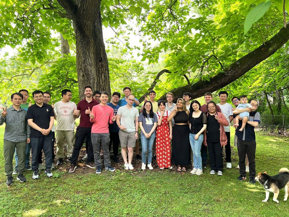 Group Photo taken outside by a tree